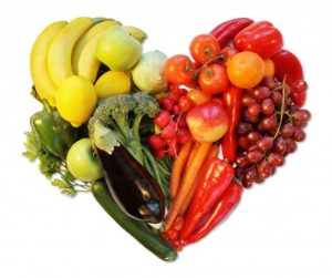 A heart shape made of fruits and veggies 