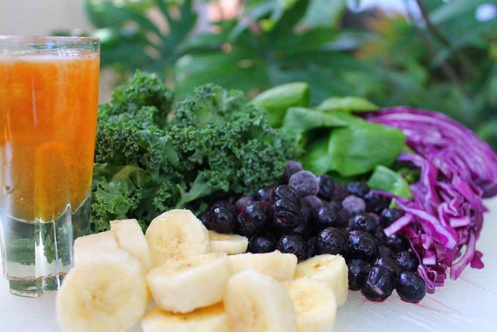 Juice with vegetables, berries, and bananas