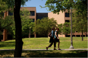 Students walking in front of Sanchez Building