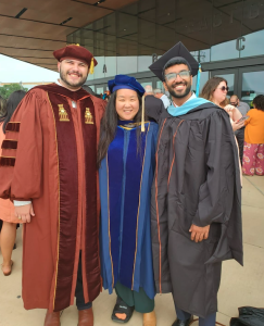 Brendan, Veronica, and Akshay in academic regalia after the 2023 Graduation ceremony